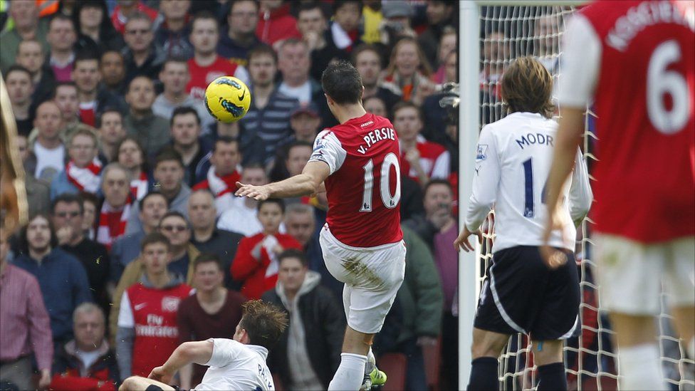 Arsenal's Robin van Persie (right) celebrates after scoring their first goal of the game