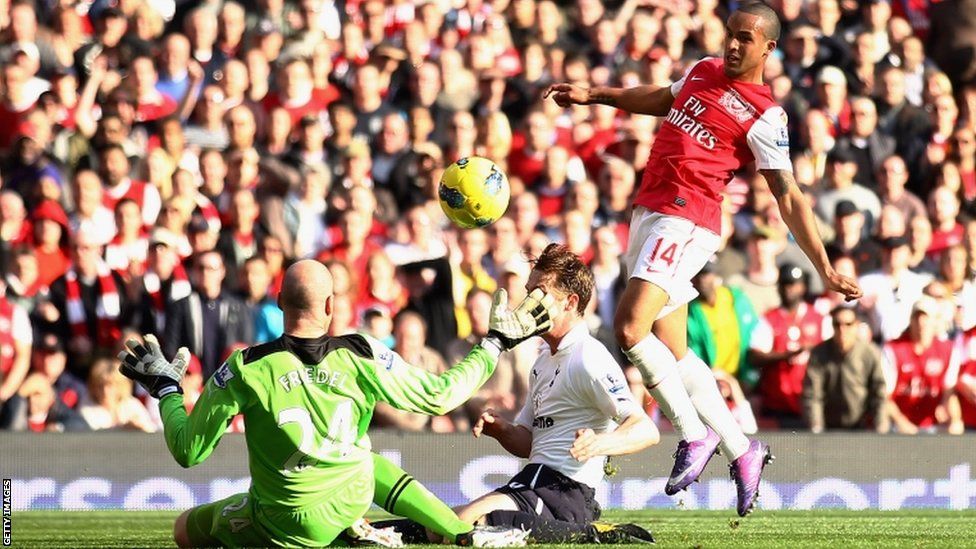 Arsenal's Theo Walcott scores his first goal of the game against Tottenham