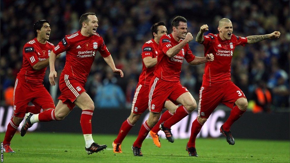 Liverpool players celebrate winning the penalty shoot-out during the Carling Cup Final at Wembley Stadium