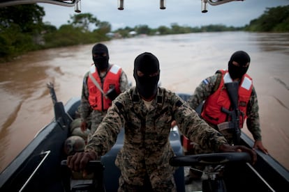 Officials from the Honduras Marines patrol the Patuca River ecosystem in search of signs of drug trafficking, in 2012.