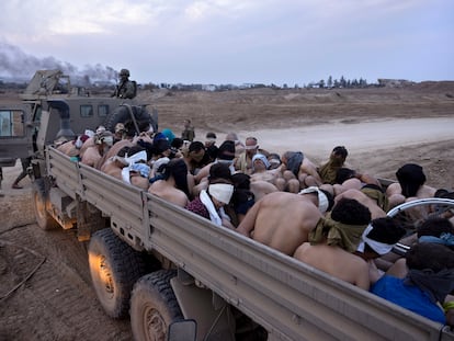 Israeli military truck loaded in Gaza with half-naked and blindfolded Palestinian detainees on December 8.