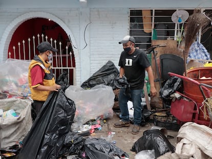 Recyclers separate plastic at a building in the Iztapalapa mayor's office in Mexico City, Aug. 10, 2020.