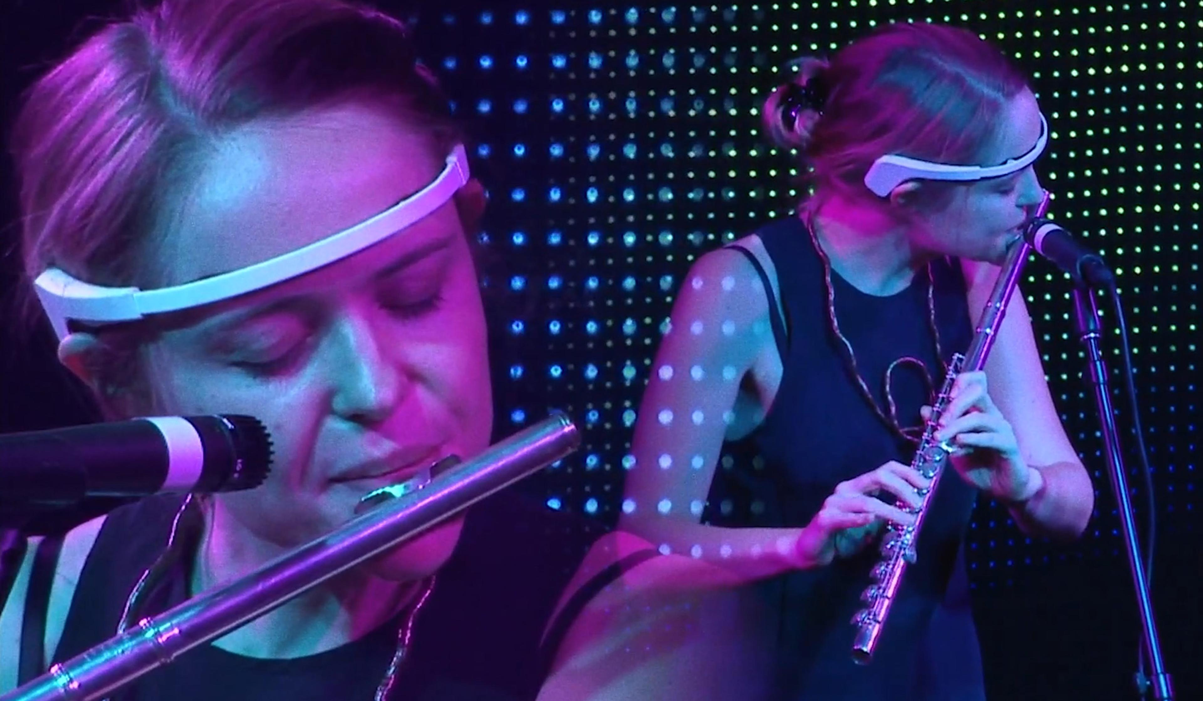 Double image of a woman playing the flute on stage, wearing a headband, with a colourful dotted background and a microphone nearby.