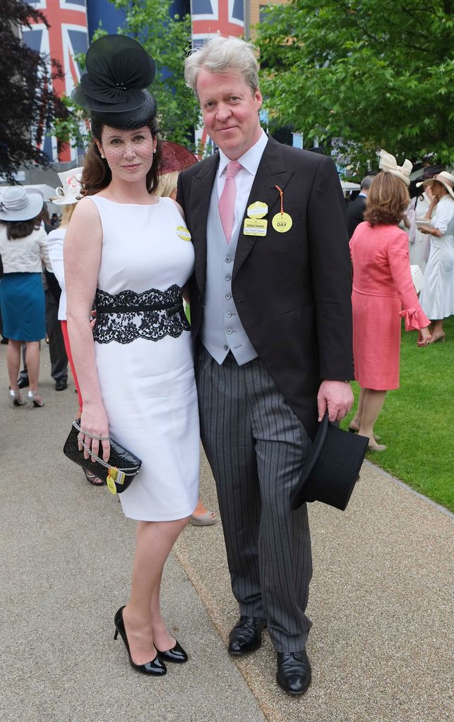 Charles Spencer in a suit with wife Karen in a white dress