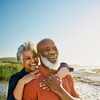 Active Mature African-American Couple Enjoying Retirement and Each Other’s Company at the Beach.