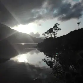 Sun peaking through the clouds at the Killary Fjord