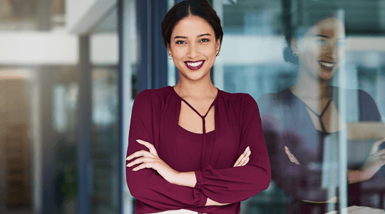 Portrait of a confident young businesswoman working in a modern office.