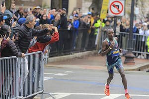 Evans Chebet rounds one of the final corners en route to his second straight Boston Marathon victory.