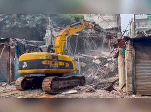 Bulldozer in Action: Lucknow Development Authority (LDA) conducts a demolition...