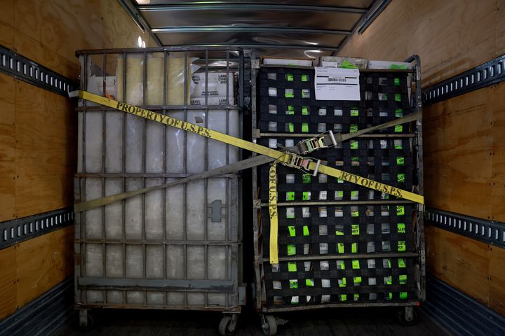 MIAMI, FLORIDA - JULY 21: Carts of vote-by-mail ballots sit in a U.S. Postal Service truck at the Miami-Dade Election Department headquarters on July 21, 2022 in Miami, Florida. The Miami-Dade County Elections Department began mailing the domestic vote-by-mail ballots to voters with a request on file for the August 23, 2022 Primary Election.