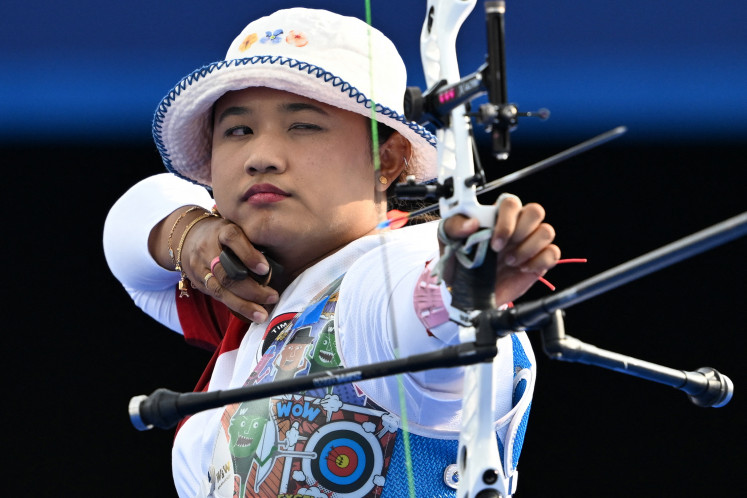 Indonesia's Rezza Octavia competes during the archery women's individual elimination round during the Paris 2024 Olympic Games at the Esplanade des Invalides in Paris on Thursday, August 1, 2024. Rezza failed to cruise from Round of 16 after being defeated 6-0 by South Korean archer Lim Si-hyeon. 