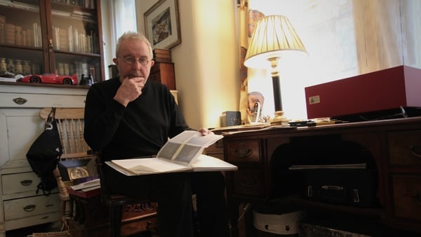 Sean Sexton looking through some of his photography collection at home in London