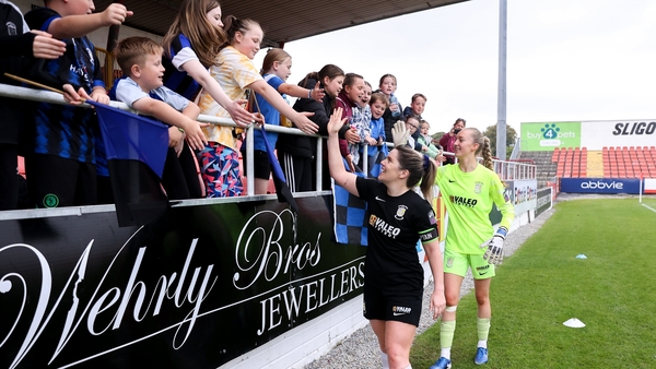 Athlone Town players Laurie Ryan and Katie Keane celebrate with supporters after winning their Sports Direct Women's FAI Cup semi-final against Sligo Rovers