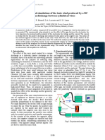 Measurements and Simulations of The Ionic Wind Produced by A DC Corona Discharge Between Cylindrical Wires