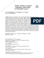 Experimental Investigation of Heave Control Technique of Expansive Soil Using Micro Piles and Geotextile Layers