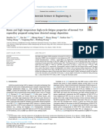 Room and High Temperature High-Cycle Fatigue Properties of Inconel 718 Superalloy Prepared Using Laser Directed Energy Deposition