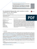 On axisymmetric diamond-like mode transitions in axially compressed core–shell cylinders