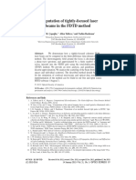 Computation of Tightly-Focused Laser Beams in The FDTD Method