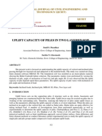 Uplift Capacity of Piles in Two Layered Soil