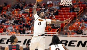 Oklahoma State forward Marchelus Avery (0) slam dunks during a game n Stillwater. (AP Photo/Mitch Alcala)