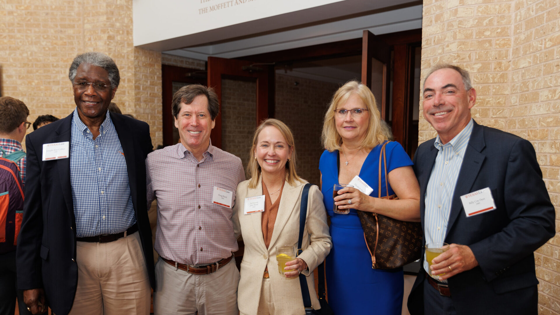 A photo of 5 alumni at the 2022 Scholarship luncheon.