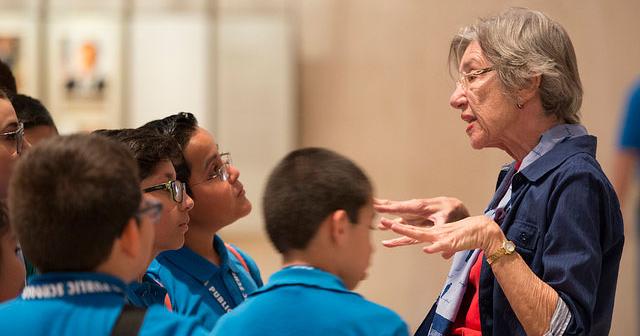 Image of tour guide speaking to students during a tour at the LBJ Library