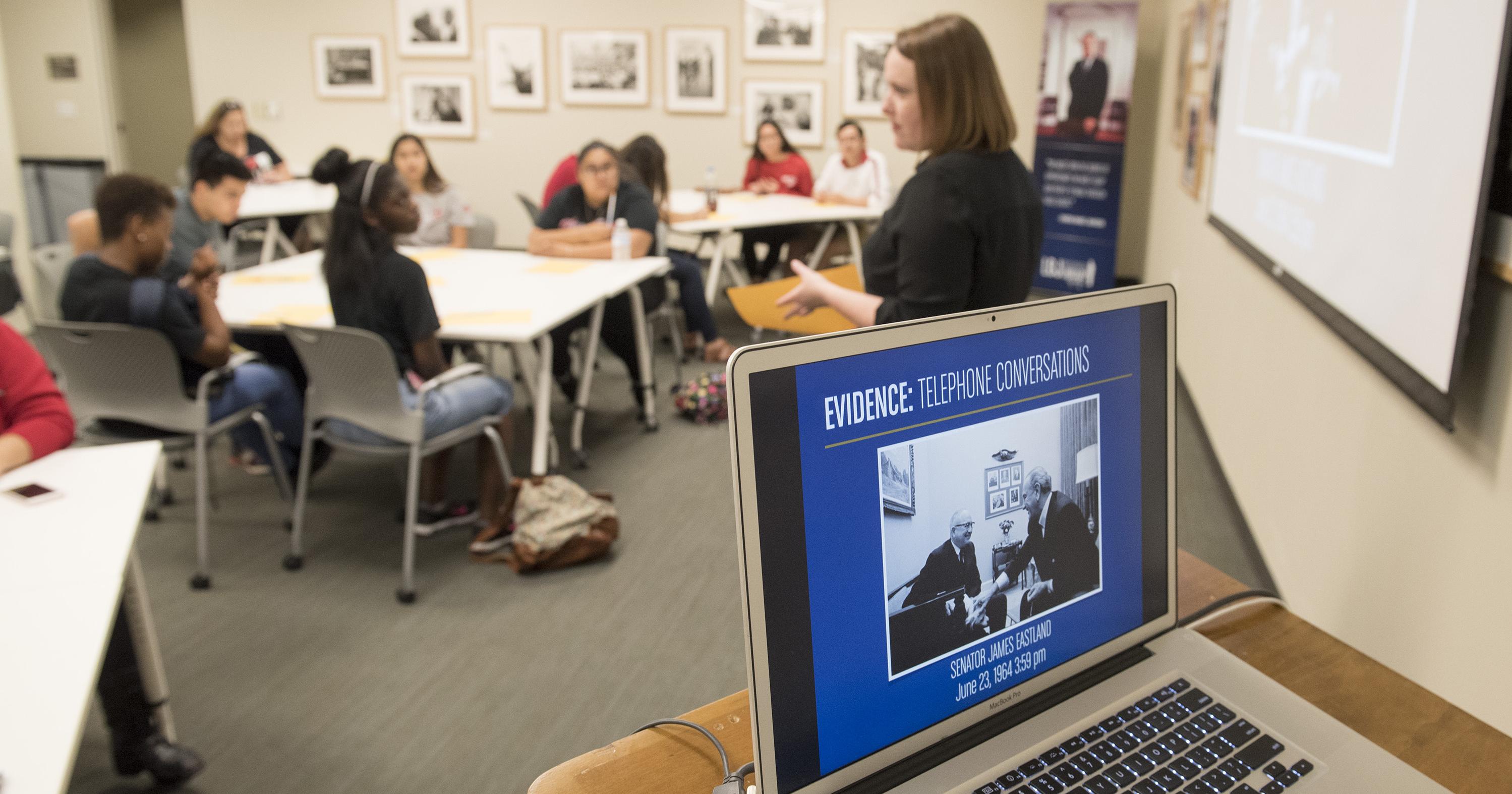 Close up of a laptop computer with an LBJ-related PowerPoint presentation on the screen.