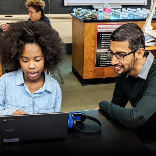 Sundar Pichai visits with students at Langley K-8 School in Pittsburgh, Pennsylvania.