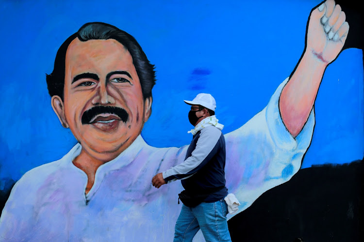 A man walks by a mural depicting Nicaraguan President Daniel Ortega, in Managua, Nicaragua, March 30 2020. Picture: REUTERS/OSWALDO RIVAS