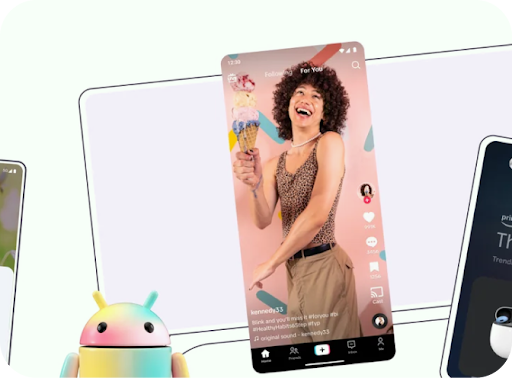 一隻多色的 Android 機械人，後面是電腦螢幕線條畫和顯示彩色 TikTok 創作者影片的手機螢幕。