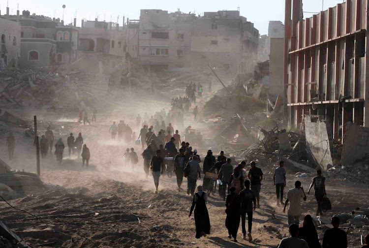 Palestinians make their way as they return to the eastern side of Khan Younis, in the southern Gaza Strip, in this file photo. Picture: REUTERS/HATEM KHALED