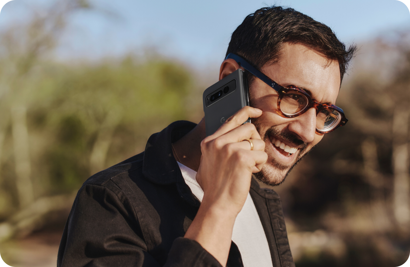 A man speaking on his Google Pixel Fold.