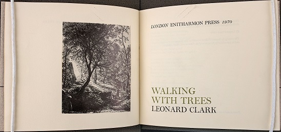 The poetry book Walking With Trees by Leonard Clark.