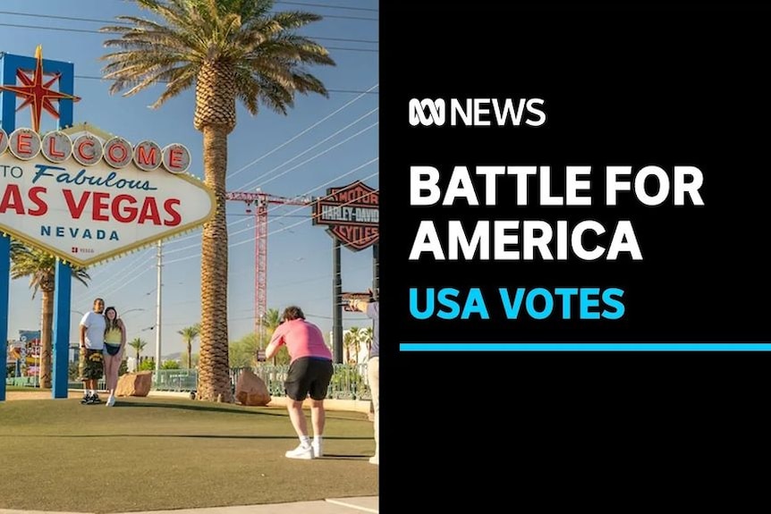 Battle for America, USA Votes: A couple has their photo taken under the iconic Las Vegas sign.
