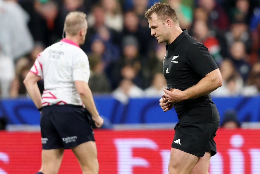 Sam Kane runs from the field after being handed a yellow card in the Rugby World Cup final.