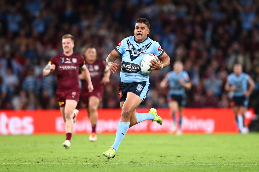 NSW rugby league star Latreell Mitchell runs in to score a try for the Blues in State of Origin.