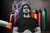 A man in black and white in front of a background of vapes.
