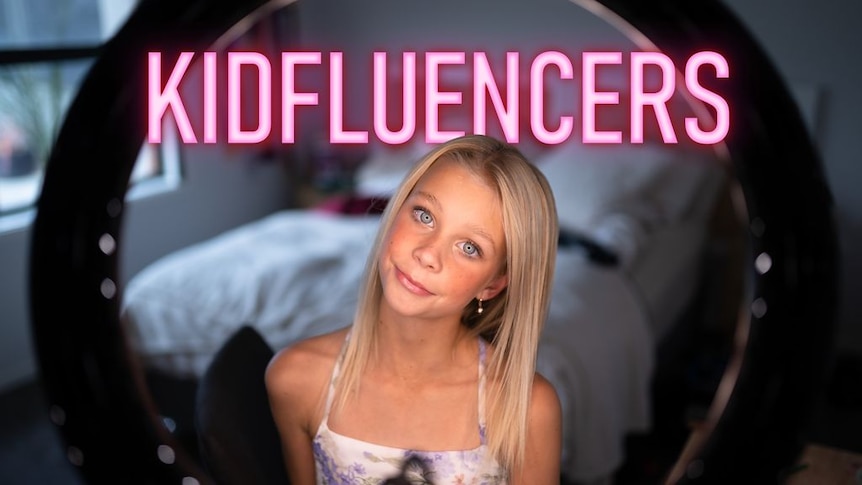 A young girl with blonde hair looks into a mirror. The word 'kidfluencers' is in neon pink above her.