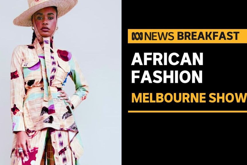 African Fashion. Melbourne Show. Model dressed in hat, matching peplum blazer and skirt with brightly colour print.