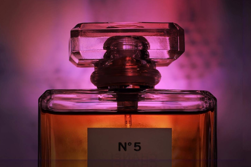 a marketing image for a bottle of perfume