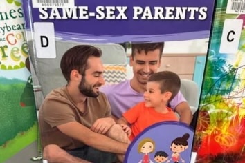 A book with the title Same-Sex parents featuring two men and a young boy