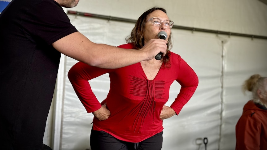 Humans competing in a crowing competition