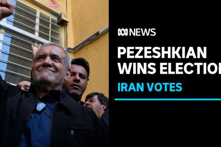 Pezeshkian Wins Election, Iran Votes: A man raises a fist with a group of people behind him.