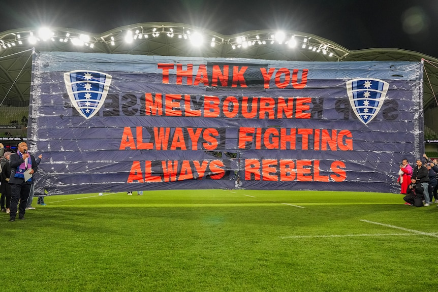 A Melbourne Rebels banner reading 'Thank you Melbourne Always fighting Always Rebels' before a Super Rugby game.