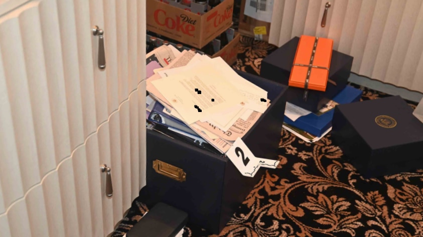 boxes on the ground of a patterned carpet 