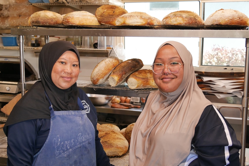Salty's cafe and bakery employees Sharifah Bos and Sa'Adia Rabuhu at work on West Island.
