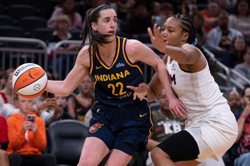 Caitlin Clark playing for Indiana Fever in WNBA preseason game.