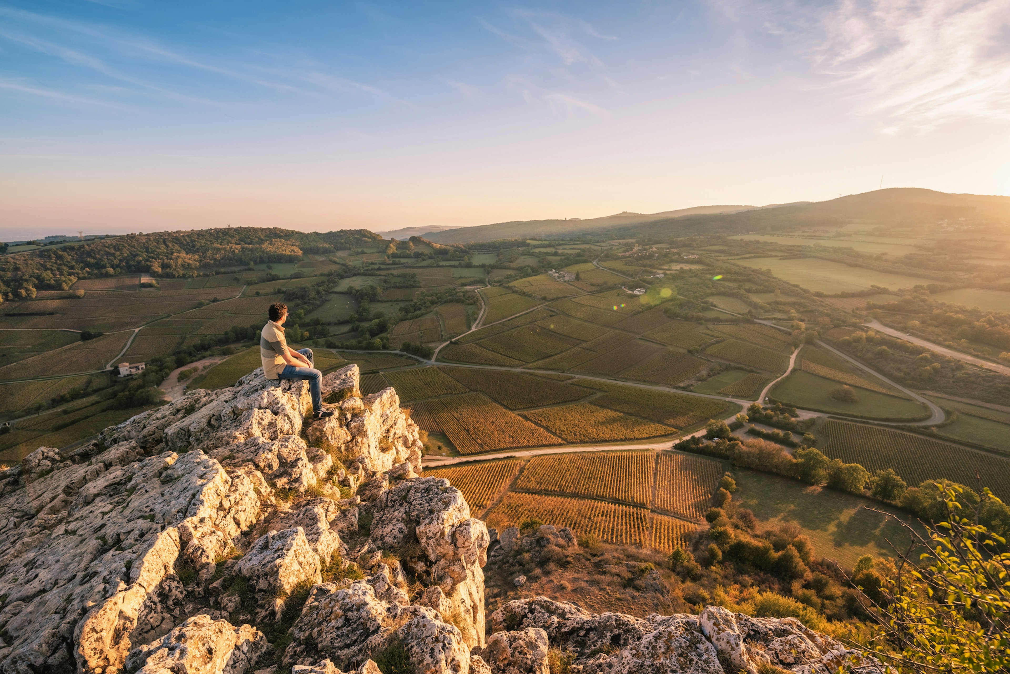 The limestone Rock of Solutre and its surrounding vineyards in Burgundy, France