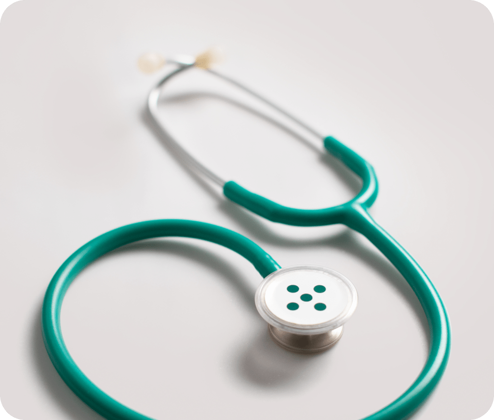 A stethoscope against a flat prime blue background.