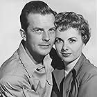 Dawn Addams and William Lundigan in Riders to the Stars (1954)